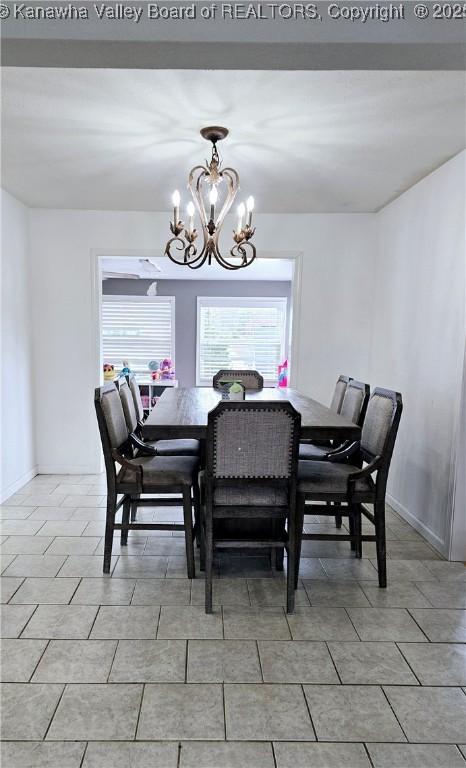 dining space featuring an inviting chandelier