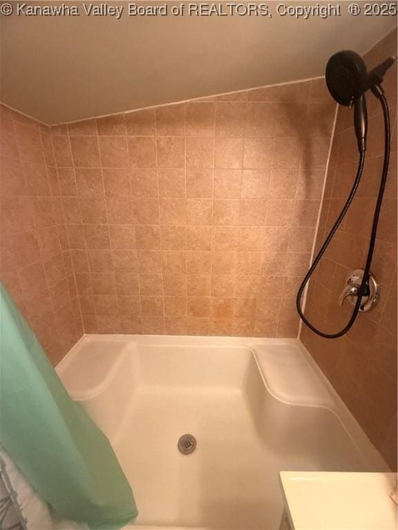 bathroom with a shower with shower curtain