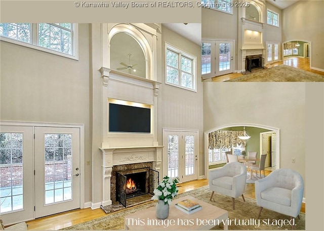 111 Graff Ln, Charleston, WV 25304 - living area featuring a fireplace, a towering ceiling, ceiling fan, wood finished floors, and healthy amount of natural light