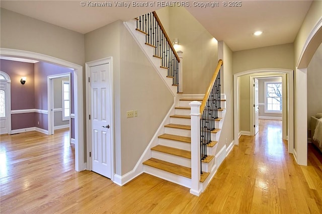 111 Graff Ln, Charleston, WV 25304 - foyer entrance with arched walkways, healthy amount of natural light, light wood-type flooring, stairs, and recessed lighting