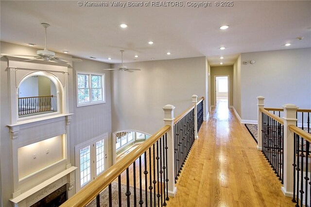 111 Graff Ln, Charleston, WV 25304 - corridor with an upstairs landing, recessed lighting, light wood-style flooring, and baseboards
