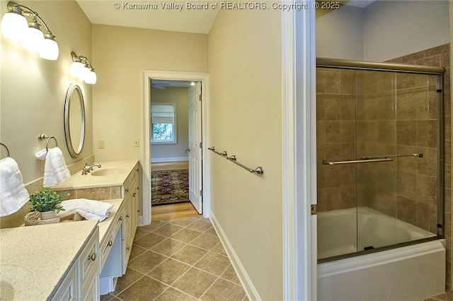 111 Graff Ln, Charleston, WV 25304 - full bath featuring vanity, shower / bath combination with glass door, tile patterned flooring, and baseboards