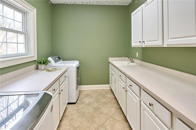 111 Graff Ln, Charleston, WV 25304 - washroom with cabinet space, separate washer and dryer, light tile patterned floors, and baseboards