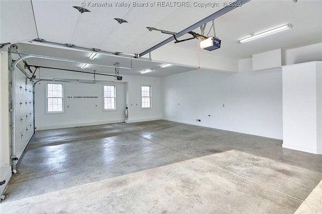 111 Graff Ln, Charleston, WV 25304 - garage featuring a garage door opener and baseboards