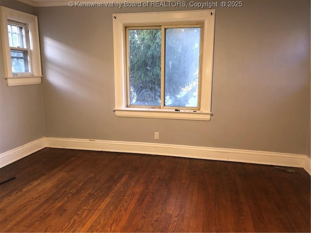 711 Hall St, Charleston, WV 25312 - unfurnished room with baseboards and dark wood-type flooring