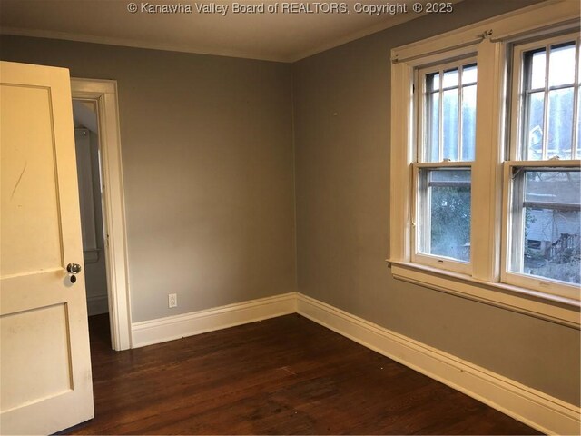 711 Hall St, Charleston, WV 25312 - empty room with ornamental molding, baseboards, and dark wood-style flooring