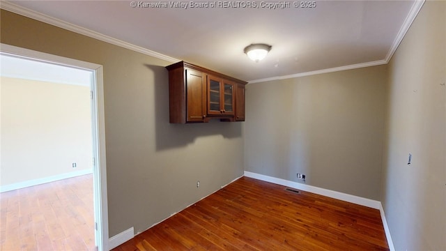 1737 US Route 60 W, Milton, WV 25541 - spare room with baseboards, wood finished floors, and ornamental molding