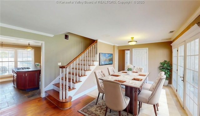 1737 US Route 60 W, Milton, WV 25541 - dining area with visible vents, baseboards, stairway, ornamental molding, and light wood-style flooring