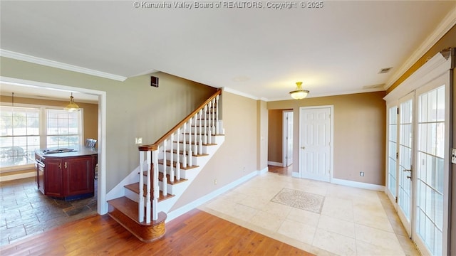 1737 US Route 60 W, Milton, WV 25541 - foyer with visible vents, ornamental molding, stairway, french doors, and baseboards
