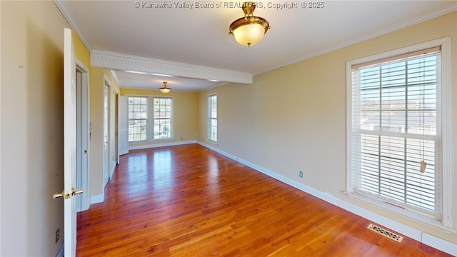 1737 US Route 60 W, Milton, WV 25541 - unfurnished room featuring visible vents, wood finished floors, baseboards, and ornamental molding