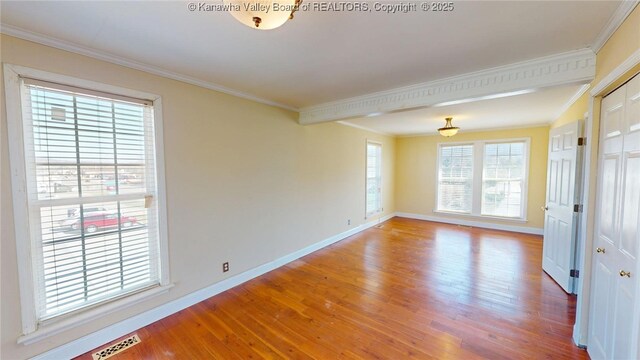 1737 US Route 60 W, Milton, WV 25541 - spare room with visible vents, baseboards, wood finished floors, and crown molding