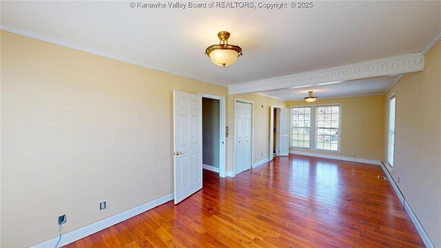 1737 US Route 60 W, Milton, WV 25541 - empty room with crown molding, wood finished floors, and baseboards