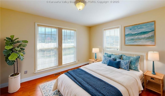 1737 US Route 60 W, Milton, WV 25541 - bedroom with visible vents, baseboards, and wood finished floors