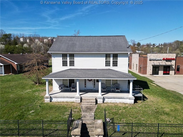 1737 US Route 60 W, Milton, WV 25541 - view of front of house featuring a front yard, a porch, fence, and roof with shingles