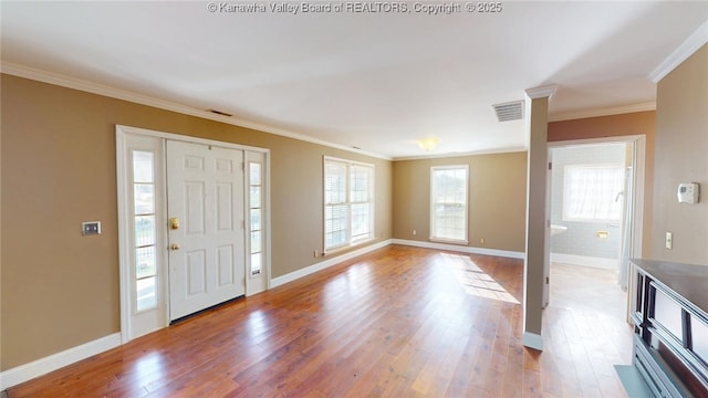 1737 US Route 60 W, Milton, WV 25541 - entrance foyer featuring visible vents, baseboards, wood finished floors, and crown molding
