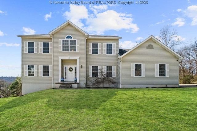 colonial inspired home featuring a front lawn