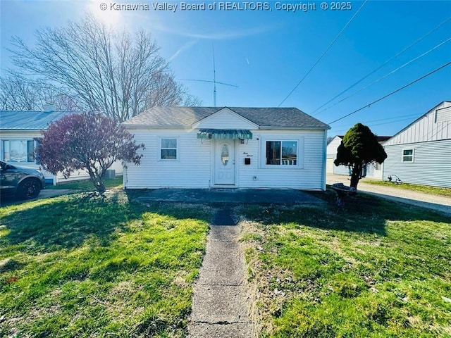 bungalow-style house featuring a front yard