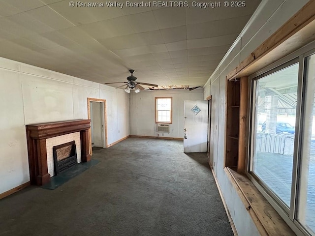 2509 Adams Ave, Huntington, WV 25704 - unfurnished living room with a brick fireplace, baseboards, carpet, and a ceiling fan