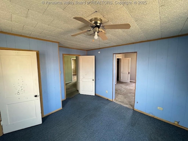 2509 Adams Ave, Huntington, WV 25704 - unfurnished bedroom featuring ceiling fan, baseboards, ornamental molding, and carpet flooring