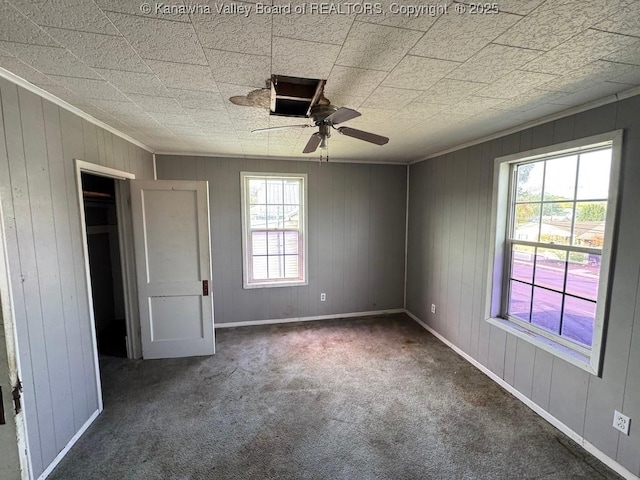 2509 Adams Ave, Huntington, WV 25704 - unfurnished bedroom featuring baseboards, carpet, and a ceiling fan