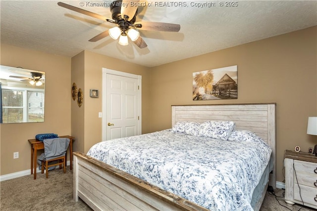 carpeted bedroom with baseboards, ceiling fan, and a textured ceiling