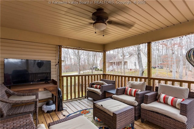 deck with an outdoor hangout area and a ceiling fan