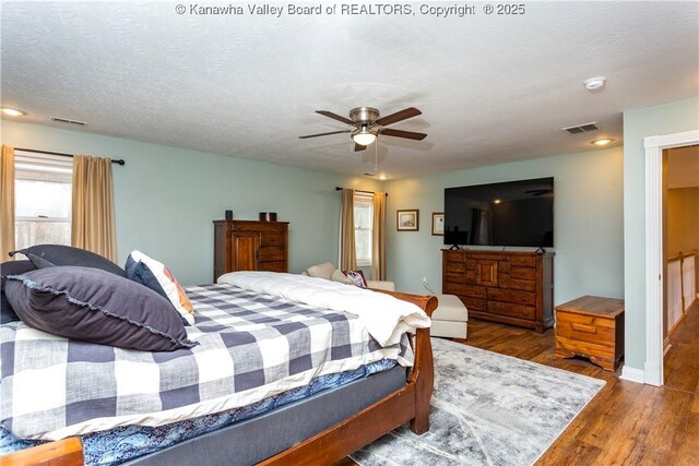 bedroom with recessed lighting, a ceiling fan, visible vents, and wood finished floors