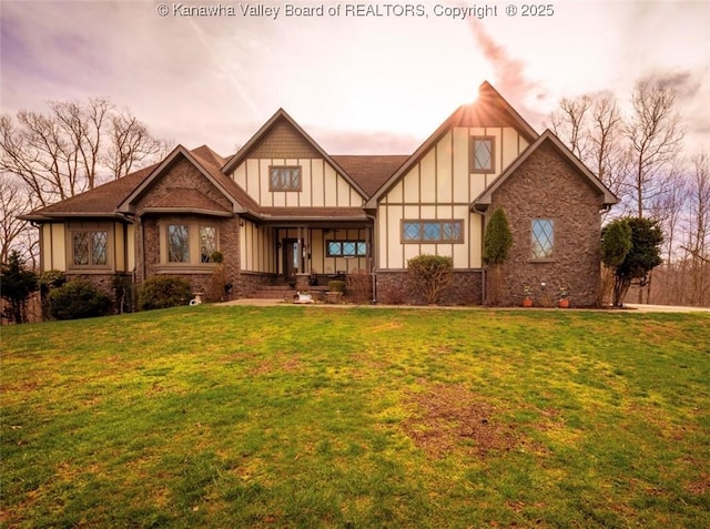 356 Latigo Pt, Milton, WV 25541 - tudor-style house with a front lawn, covered porch, board and batten siding, and stone siding