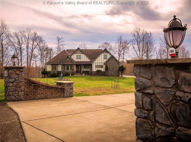 356 Latigo Pt, Milton, WV 25541 - exterior space featuring a front lawn and board and batten siding