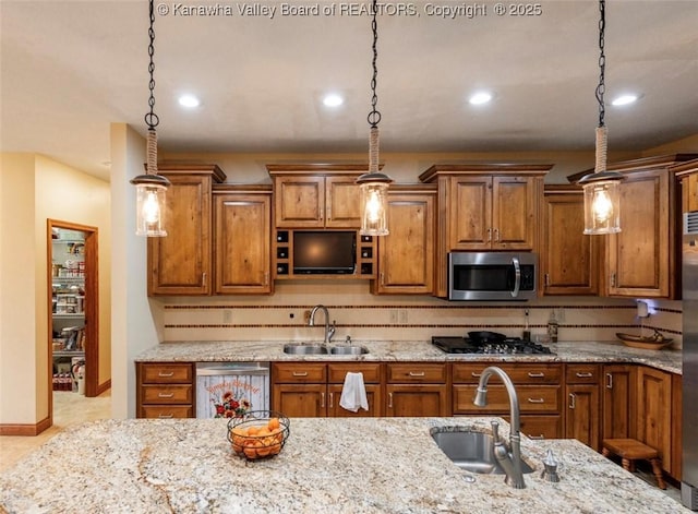 356 Latigo Pt, Milton, WV 25541 - kitchen with appliances with stainless steel finishes, brown cabinetry, light stone counters, and recessed lighting