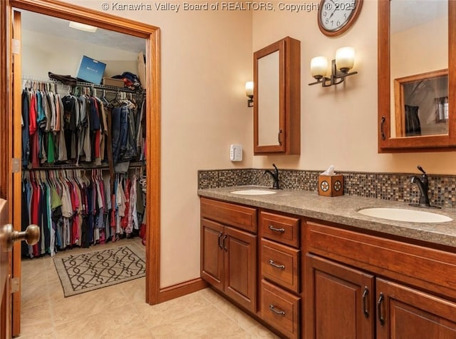 356 Latigo Pt, Milton, WV 25541 - bathroom with tile patterned floors, double vanity, and a spacious closet