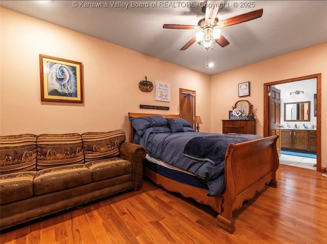 356 Latigo Pt, Milton, WV 25541 - bedroom with wood finished floors, connected bathroom, and a ceiling fan