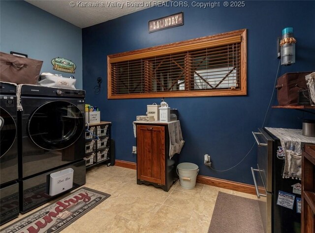 356 Latigo Pt, Milton, WV 25541 - laundry room featuring washing machine and dryer, a textured ceiling, and tile patterned floors