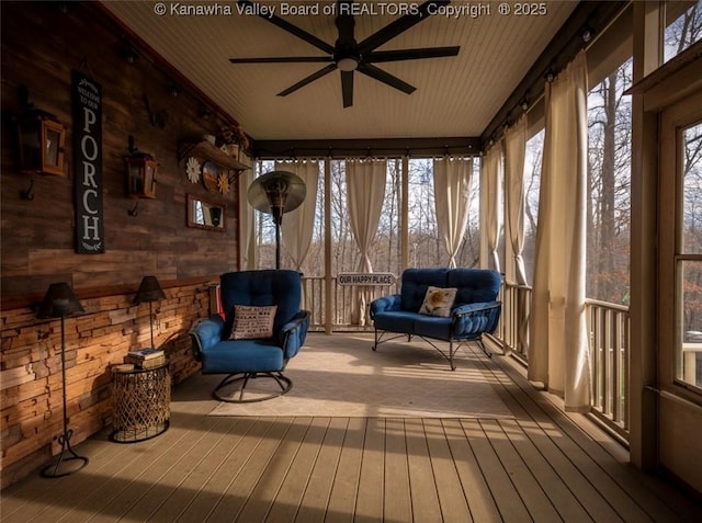 356 Latigo Pt, Milton, WV 25541 - sunroom with wooden walls and wood-type flooring
