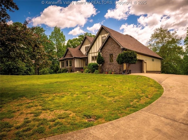 356 Latigo Pt, Milton, WV 25541 - tudor-style house featuring board and batten siding, driveway, a front lawn, an attached garage, and stone siding
