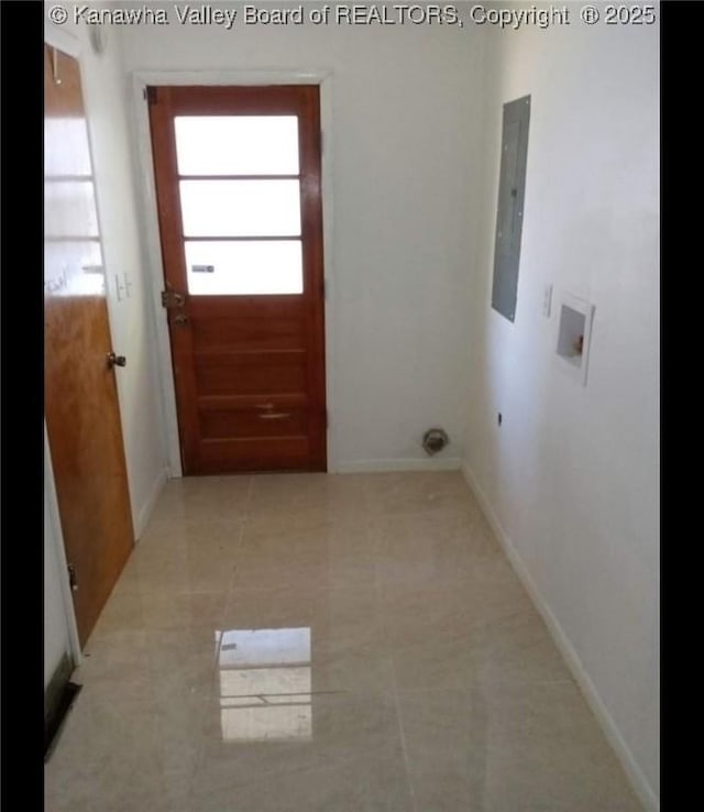 laundry room featuring electric panel, washer hookup, baseboards, laundry area, and tile patterned floors