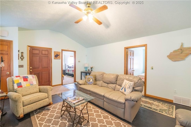 carpeted living area with baseboards, vaulted ceiling, visible vents, and ceiling fan