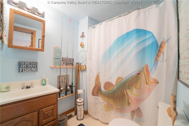 bathroom featuring a shower with curtain and vanity