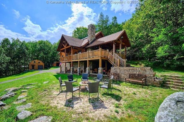 510 Shamrock Dr, Union, WV 26833 - rear view of property with a fire pit, stairs, a chimney, an outbuilding, and a yard