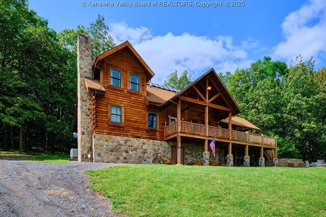 510 Shamrock Dr, Union, WV 26833 - view of front facade featuring a chimney, a wooden deck, a front yard, and log exterior