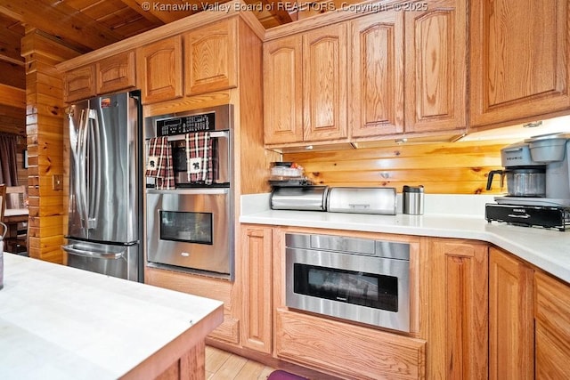 510 Shamrock Dr, Union, WV 26833 - kitchen featuring light wood-type flooring, light countertops, appliances with stainless steel finishes, and brown cabinetry