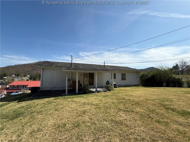 back of house with a yard