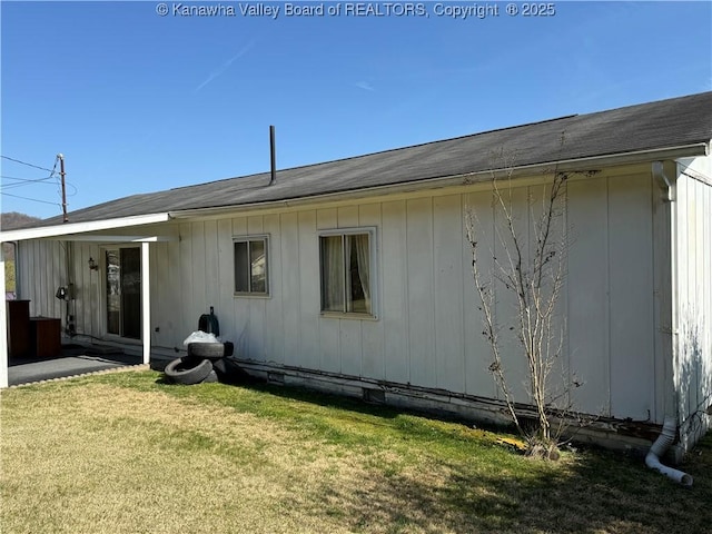 back of property with a yard