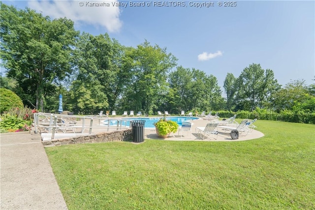 1800 Roundhill Rd Unit 404, Charleston, WV 25314 - community pool featuring a patio area, a yard, and view of scattered trees