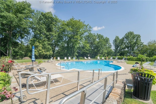 1800 Roundhill Rd Unit 404, Charleston, WV 25314 - community pool featuring a patio area and view of scattered trees
