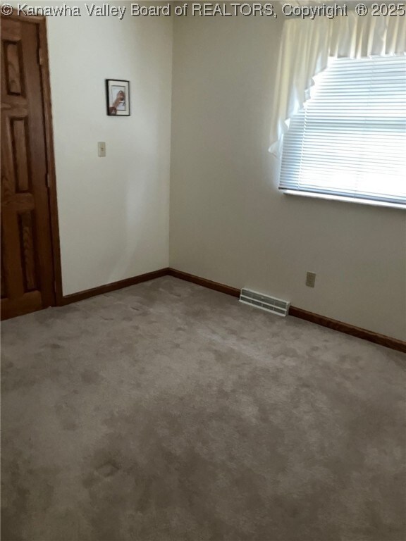 237 Lewis Ln, Point Pleasant, WV 25550 - empty room with baseboards, visible vents, and light colored carpet