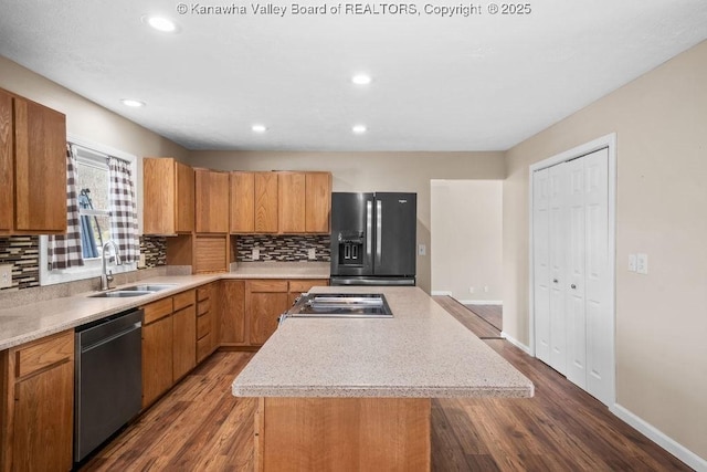 25 Lilly Hls, South Charleston, WV 25309 - kitchen featuring light countertops, dishwasher, a sink, a kitchen island, and black fridge with ice dispenser