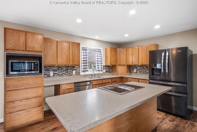 25 Lilly Hls, South Charleston, WV 25309 - kitchen with a sink, dark wood-style flooring, recessed lighting, decorative backsplash, and appliances with stainless steel finishes