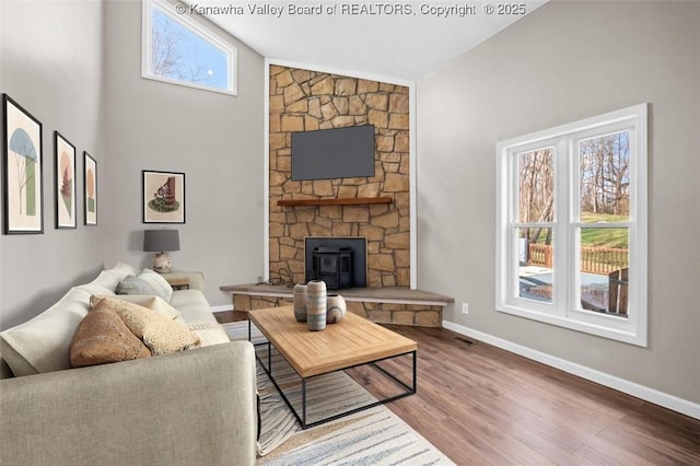 25 Lilly Hls, South Charleston, WV 25309 - living area featuring baseboards, visible vents, wood finished floors, and high vaulted ceiling
