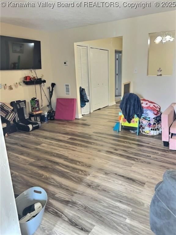 rec room with visible vents and wood finished floors